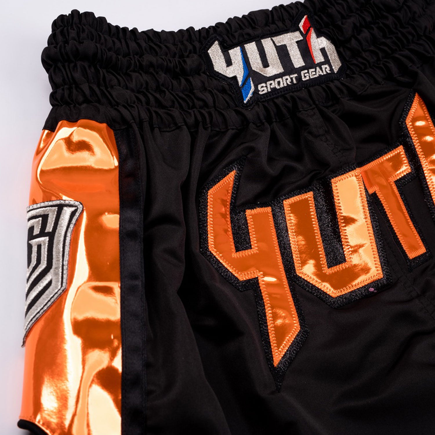 yhmts-001-yuth-hologram-muaythai-shorts-black-orange-2